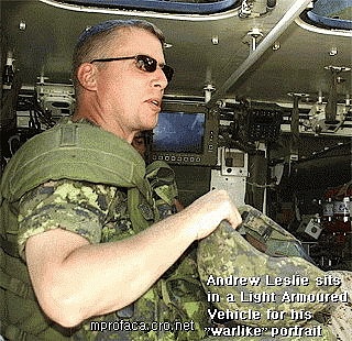 Andrew_Leslie sits in 
a Light Armoured Vehicle (LAVlll)
for his 'warlike' portrait.