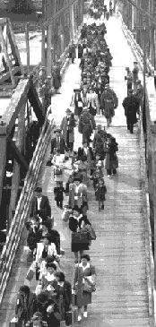 Bainbridge 
  Island evacuees boarding ferry under army guard